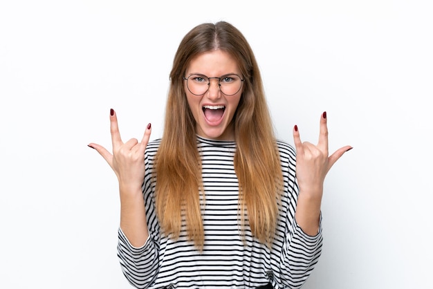 Young caucasian woman isolated on white background making horn gesture