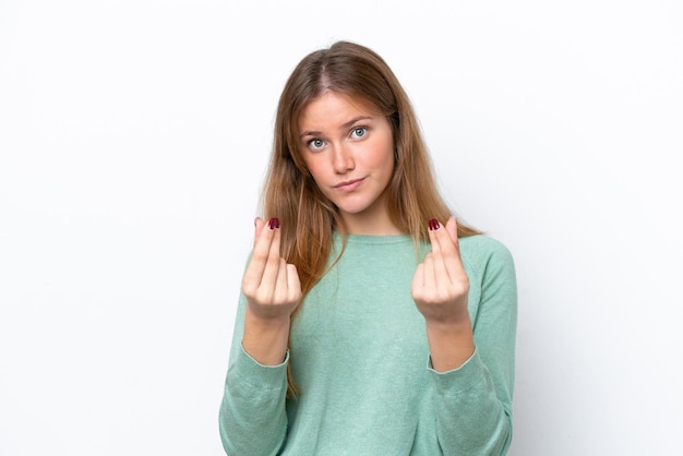 Young caucasian woman isolated on white background making money gesture but is ruined