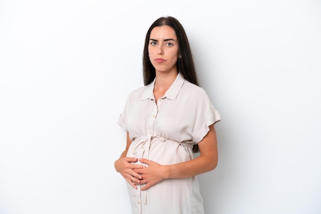 Young caucasian woman isolated on white background pregnant