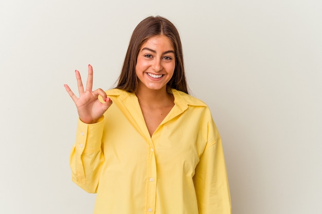 Young caucasian woman isolated on white background shocked covering mouth with hands.