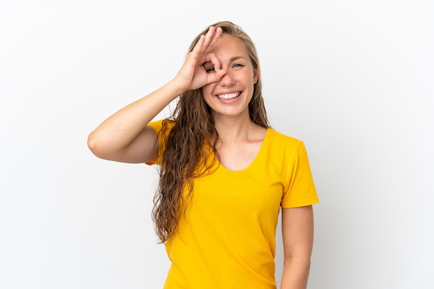 Young caucasian woman isolated on white background showing ok sign with fingers