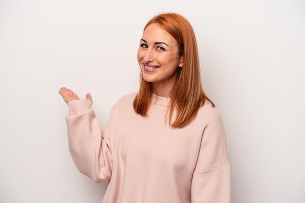 Young caucasian woman isolated on white background showing a welcome expression.