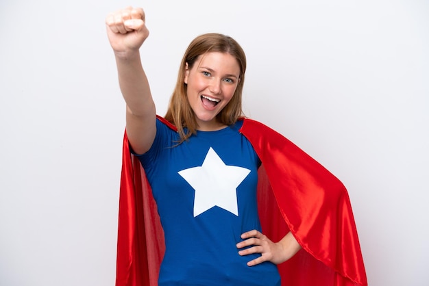 Young caucasian woman isolated on white background in superhero costume with proud gesture