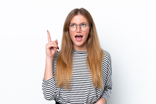 Young caucasian woman isolated on white background thinking an idea pointing the finger up