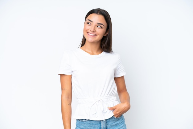 Young caucasian woman isolated on white background thinking an idea while looking up