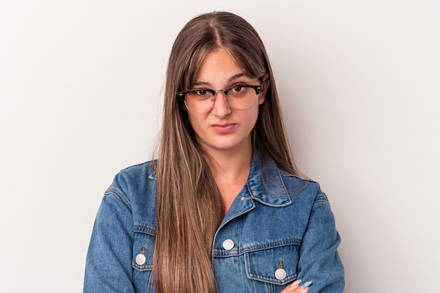 Young caucasian woman isolated on white background unhappy looking in camera with sarcastic expression.