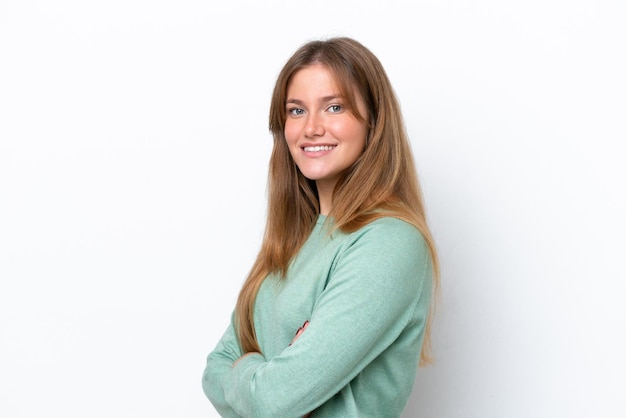 Young caucasian woman isolated on white background with arms crossed and looking forward