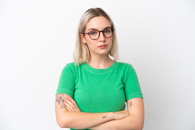 Young caucasian woman isolated on white background With glasses and arms crossed