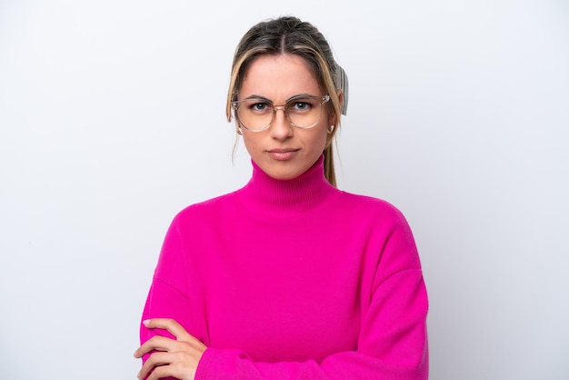 Young caucasian woman isolated on white background With glasses and arms crossed