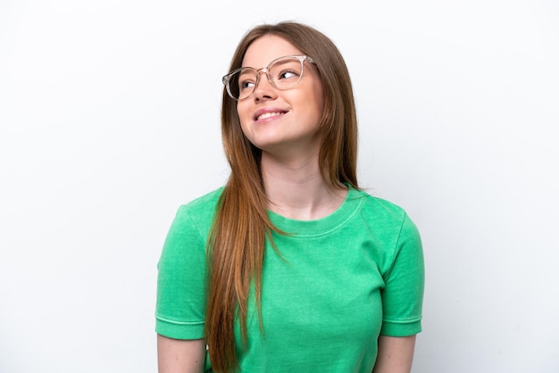 Young caucasian woman isolated on white background With glasses with happy expression