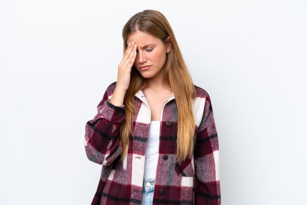 Young caucasian woman isolated on white background with headache