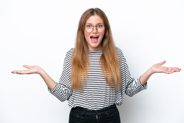 Young caucasian woman isolated on white background with shocked facial expression