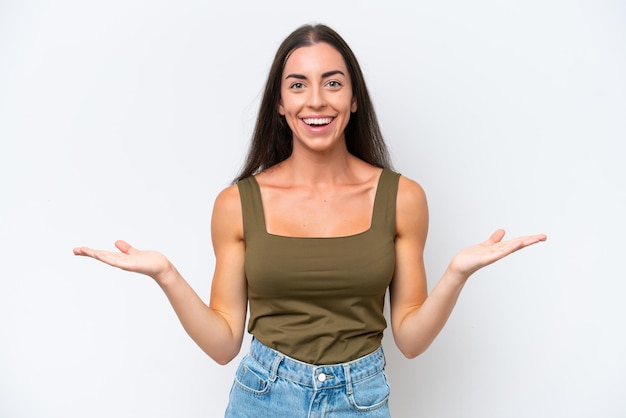 Young caucasian woman isolated on white background with shocked facial expression