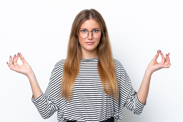 Young caucasian woman isolated on white background in zen pose