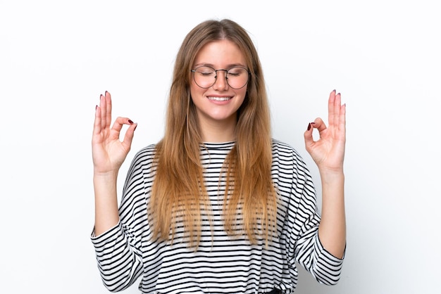 Young caucasian woman isolated on white background in zen pose