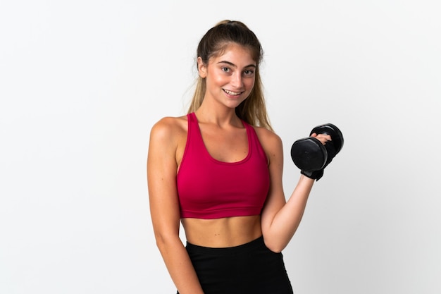 Young caucasian woman isolated on white making weightlifting