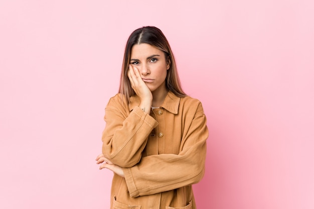 Young caucasian woman isolated who is bored, fatigued and need a relax day.