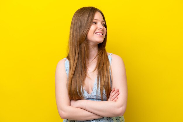 Young caucasian woman isolated on yellow background happy and smiling