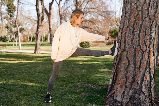 A young caucasian woman stretching for a healthy start