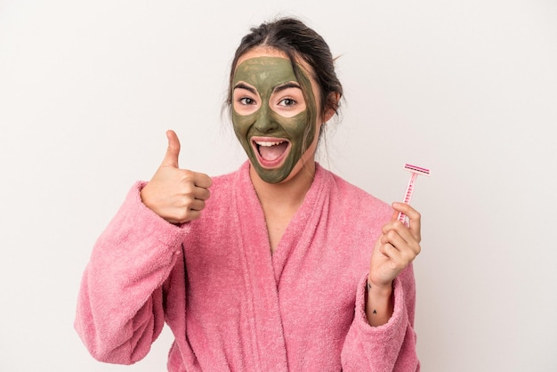 Young caucasian woman wearing a facial mask was isolated on white background