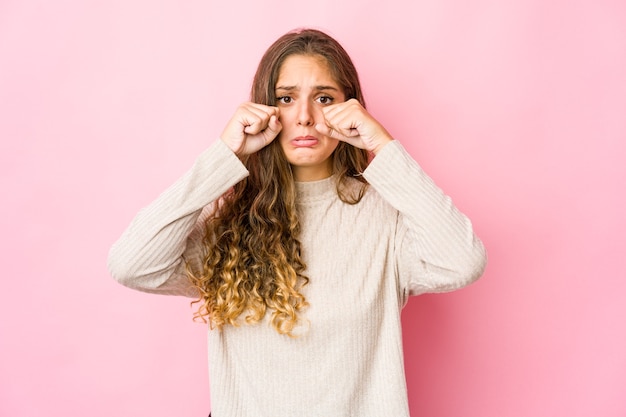 Young caucasian woman whining and crying disconsolately