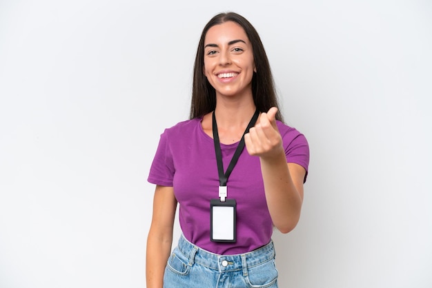 Young caucasian woman with ID card isolated on white background making money gesture