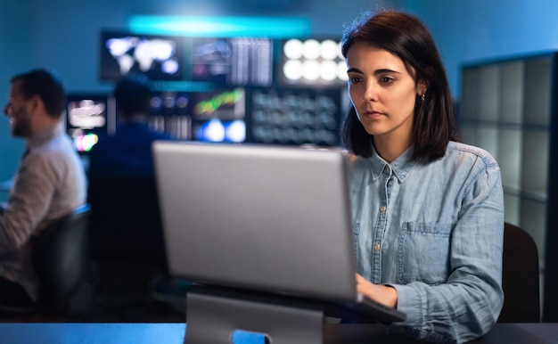 Young caucasian woman working in the office using laptop Financial analyst trader and stock market Women at work concept