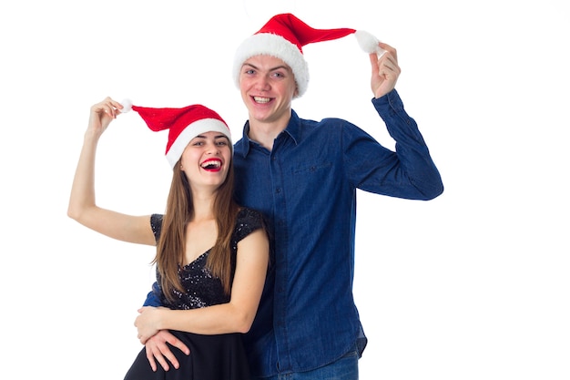 Young cheerful couple in love celebrate christmas isolated on white background