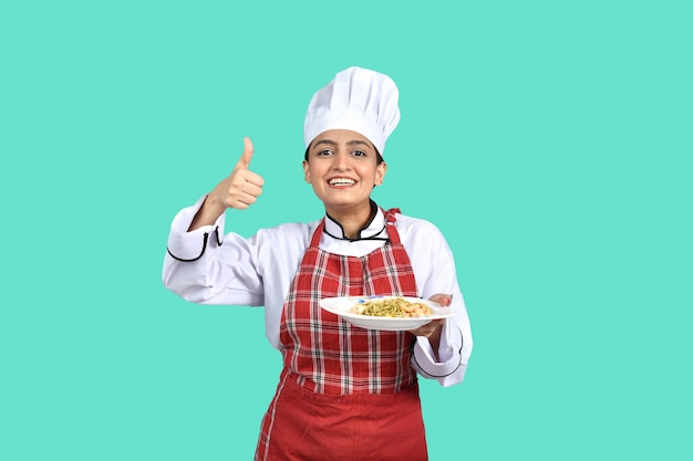 young chef girl white outfit holding a plate indian pakistani model