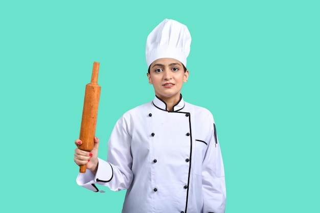 young chef girl white outfit holding rolling pin indian pakistani model