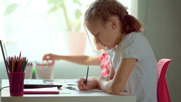 Young children doing their homework together