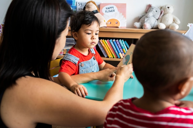 Young children learning the English alphabet with their parents