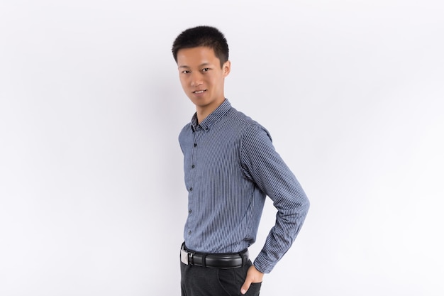 Young Chinese business male in front of white background