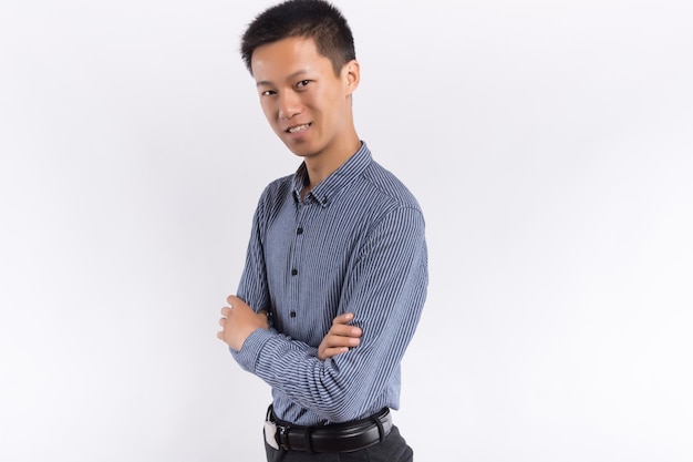 Young Chinese business male in front of white background