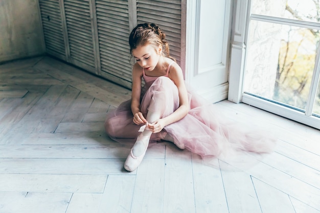 Young classical ballet girl in dance class