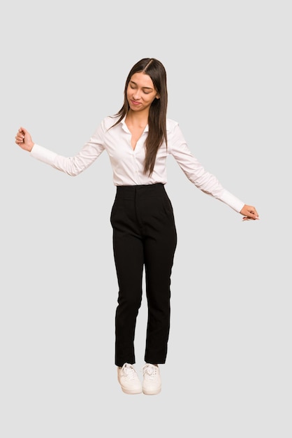 Young colombian woman standing full body cut out isolated