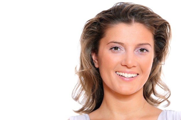 a young confident beautiful woman smiling over white background