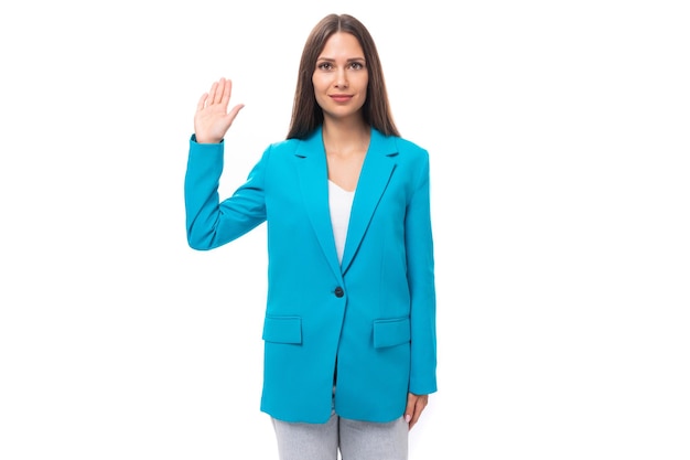 Young confident pretty brunette leader woman with long hair in a blue jacket