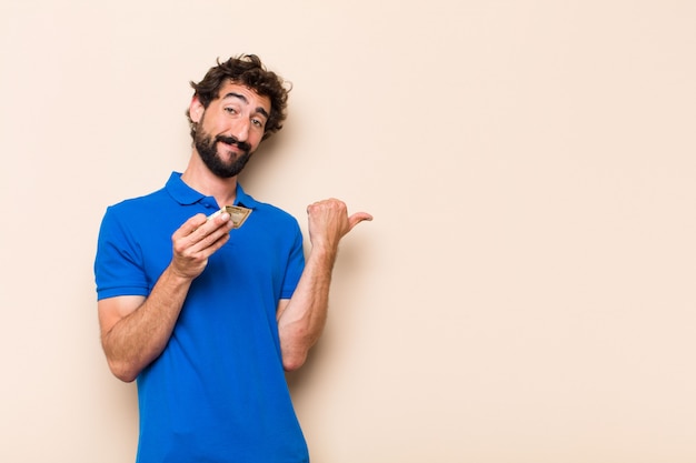 Young cool bearded man with dolar banknotes