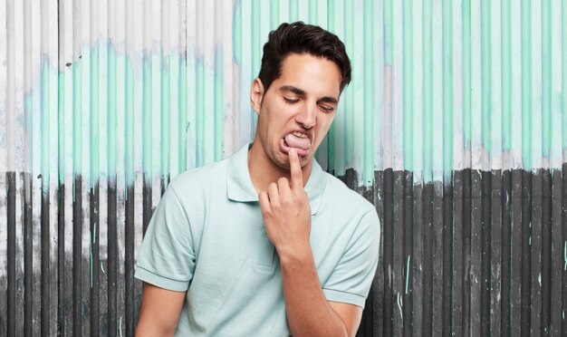 Young cool man against grunge background