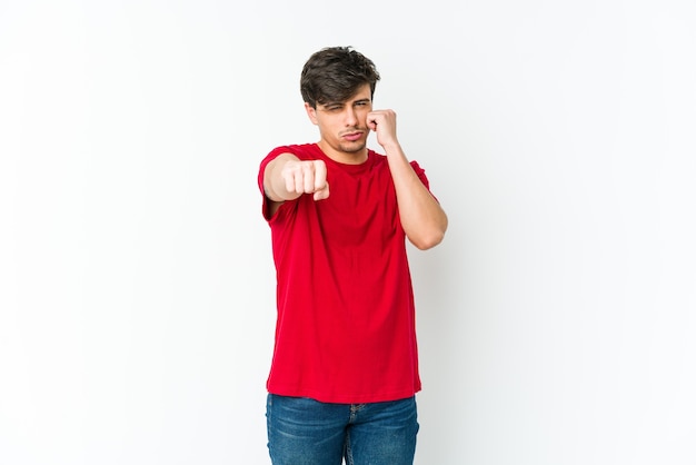 Young cool man throwing a punch, anger, fighting due to an argument, boxing.