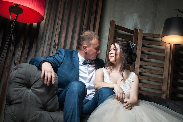 Young couple of the bride and groom in a beautiful interior room