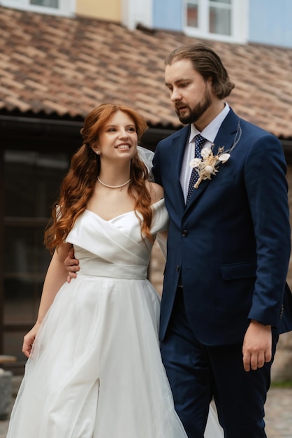 Young couple bride and groom in a white dress