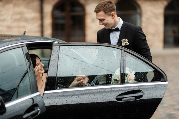 Young couple bride and groom in a white short dress