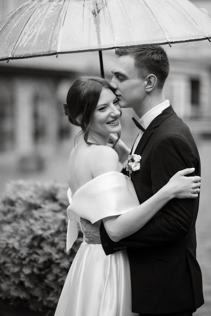 Young couple bride and groom in a white short dress