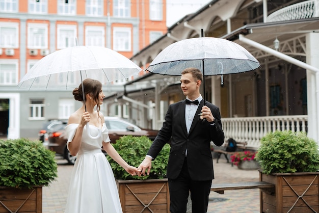 Young couple bride and groom in a white short dress