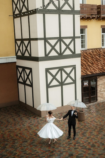 Young couple bride and groom in a white short dress