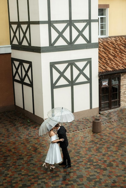 Young couple bride and groom in a white short dress