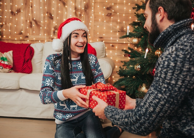 A young couple celebrating the holiday at home