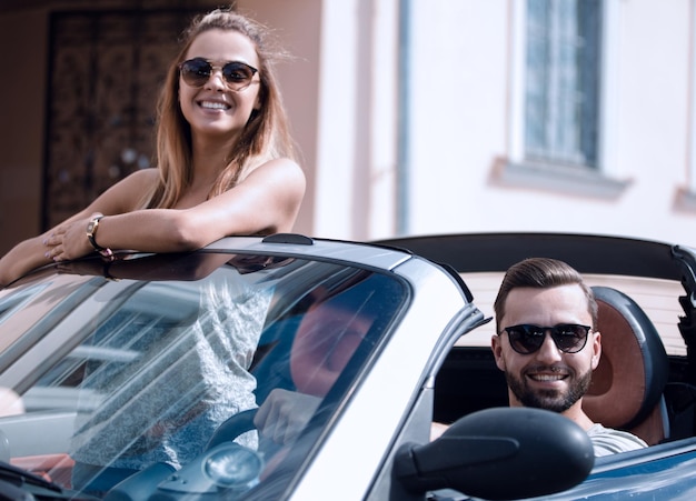 Young couple in convertible car